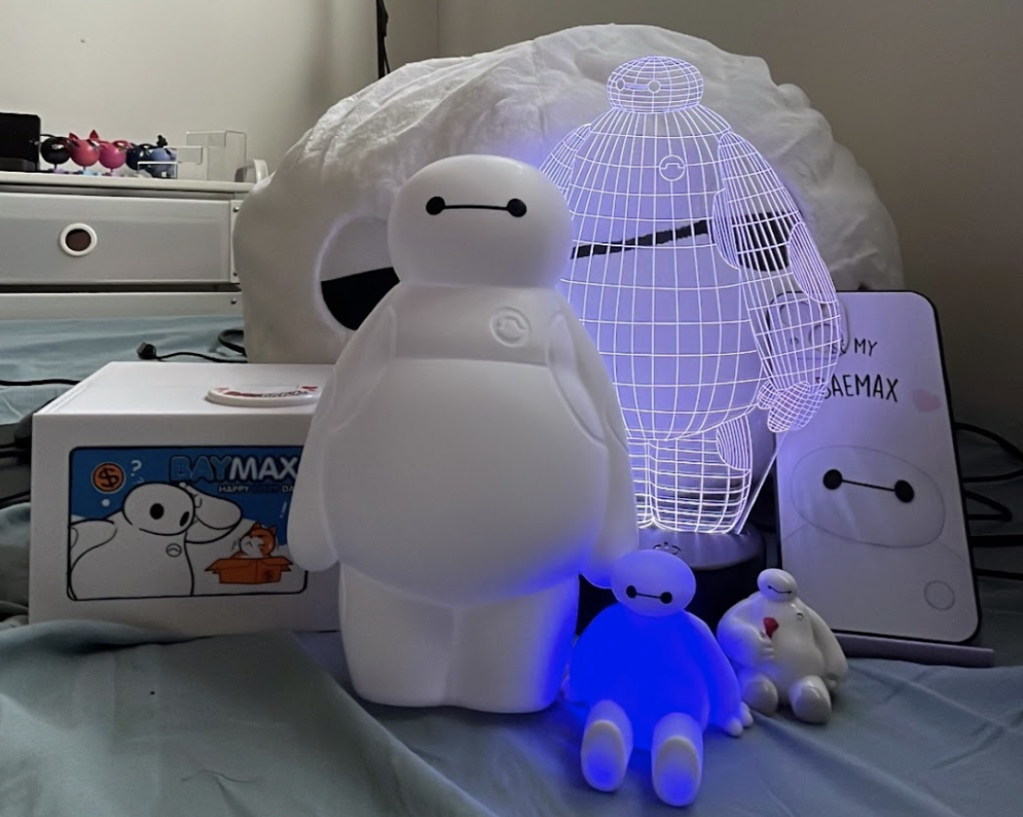 An array of Disney Baymax figurines, plushies and toys
